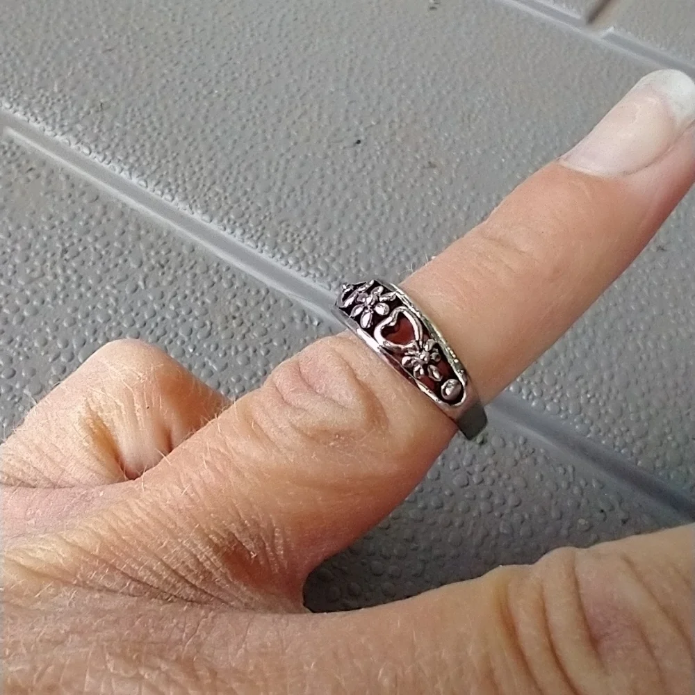 Women's marked S floral ring.
